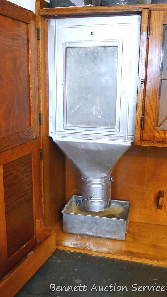 Beautiful antique Hoosier-style kitchen cabinet has flour sifter and metal lined drawer with vented