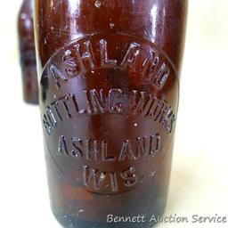 Six antique cast glass beer bottles marked Ashland Bottling Works, Ashland Wis. Each measures 2-1/2"