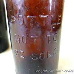 Six antique cast glass beer bottles marked Ashland Bottling Works, Ashland Wis. Each measures 2-1/2"