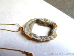 Pretty polished agate pendant on a fine gold toned chain measures 13" long overall. Pendant is