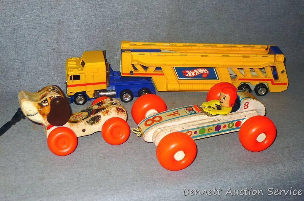 Vintage and newer toys including Fisher Price Bouncy Racer and Little Snoopy wooden pull toys. Also