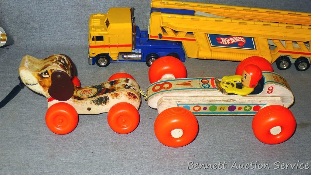 Vintage and newer toys including Fisher Price Bouncy Racer and Little Snoopy wooden pull toys. Also