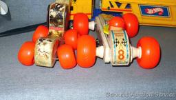 Vintage and newer toys including Fisher Price Bouncy Racer and Little Snoopy wooden pull toys. Also