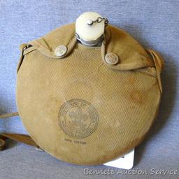Vintage Boy Scout canteen with cotton cover and strap. Measures 8" across.