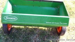 Scotts spreader has a 2' wide bin and looks to be in good shape.