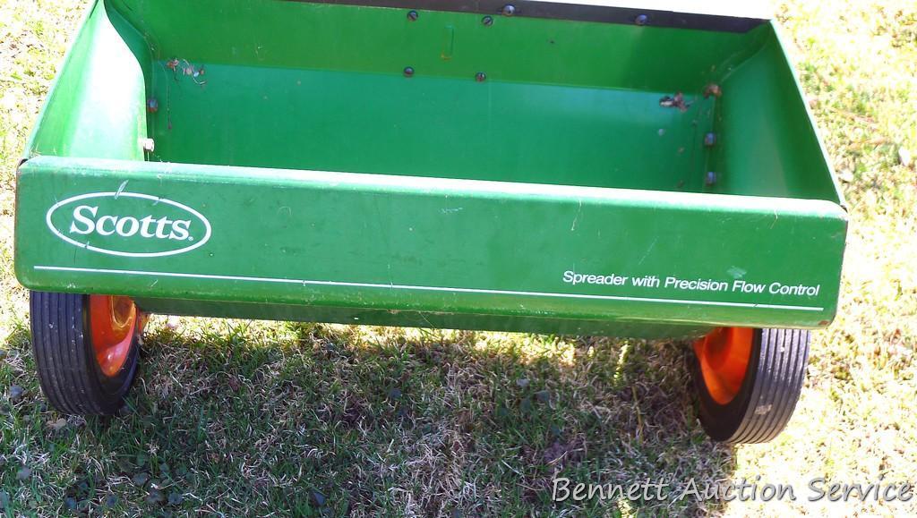 Scotts spreader has a 2' wide bin and looks to be in good shape.