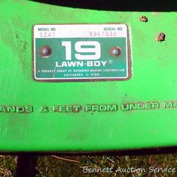 Older model Lawn Boy 21 push mower is for parts or repair. Family says it doesn't run.