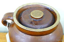 One handled bean pot is stamped '3' on bottom, measures 8 - 1/2"x 7 - 1/2" x 7" tall. Cover has a