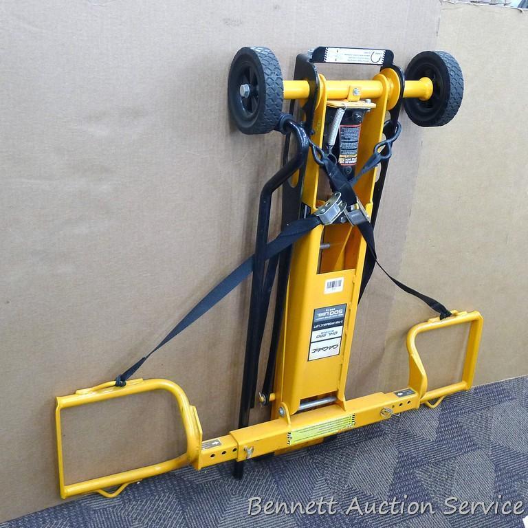 Cub Cadet two ton hydraulic lift, appears to be new. Measures approx. 48"x 40".