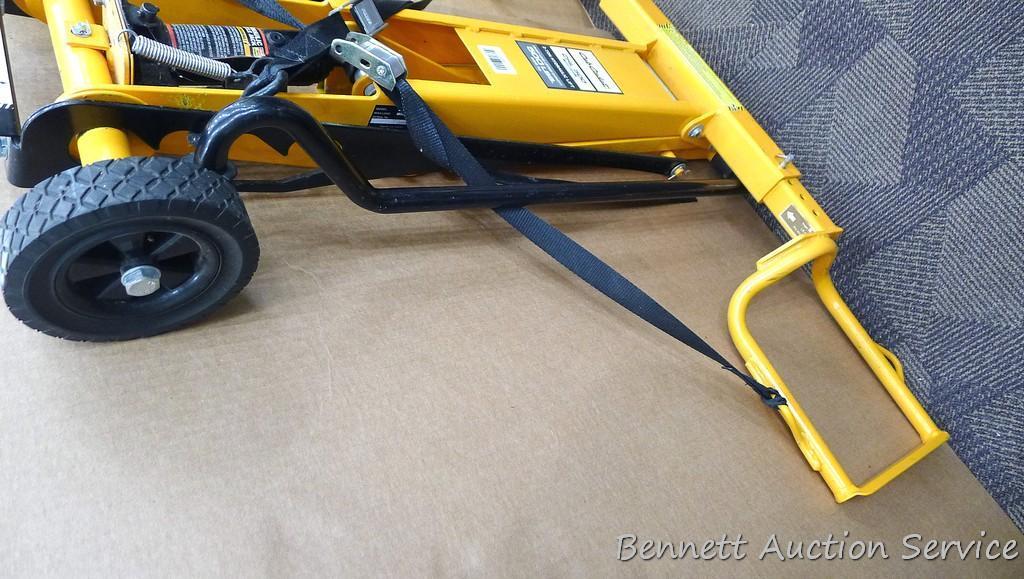 Cub Cadet two ton hydraulic lift, appears to be new. Measures approx. 48"x 40".