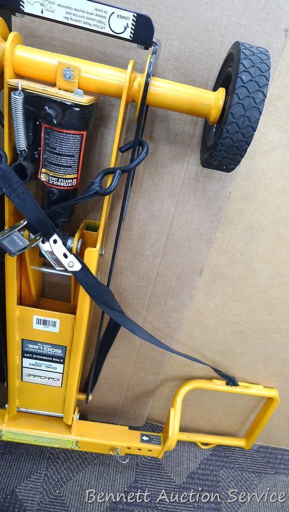 Cub Cadet two ton hydraulic lift, appears to be new. Measures approx. 48"x 40".