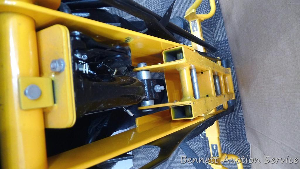 Cub Cadet two ton hydraulic lift, appears to be new. Measures approx. 48"x 40".