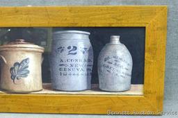 Nicely framed print of pottery. Measures approx. 10" x 26" over rustic frame.