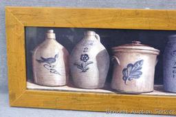 Nicely framed print of pottery. Measures approx. 10" x 26" over rustic frame.