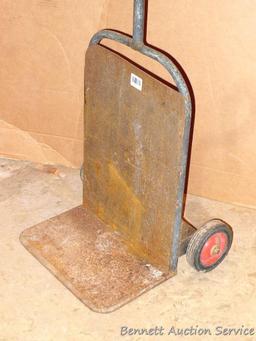 Metal hand cart measures 20.5" x 45" tall x 14". Feels very sturdy but needs one wheel replaced.