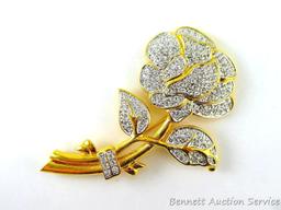 Gold toned and sparkly brooch measures 3-3/4" and if the box is any indication, it's part of the