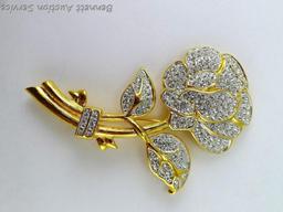 Gold toned and sparkly brooch measures 3-3/4" and if the box is any indication, it's part of the