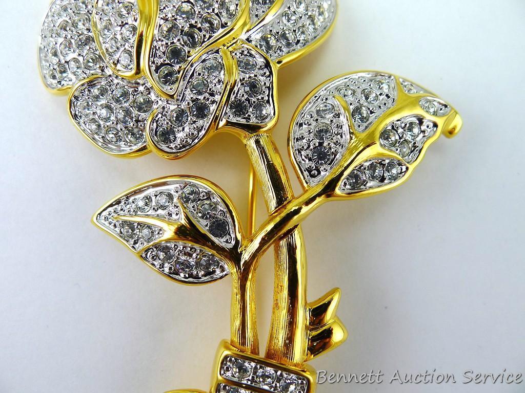 Gold toned and sparkly brooch measures 3-3/4" and if the box is any indication, it's part of the