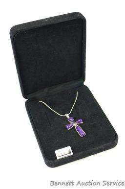 Cross Pendant on a 16" chain; pendant measures 3/4" x 1" and both pendant and chain clasp are