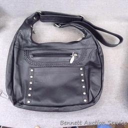 Rama Leathers genuine cowhide leather concealment purse is like new. Bag measures about 14"x 11",