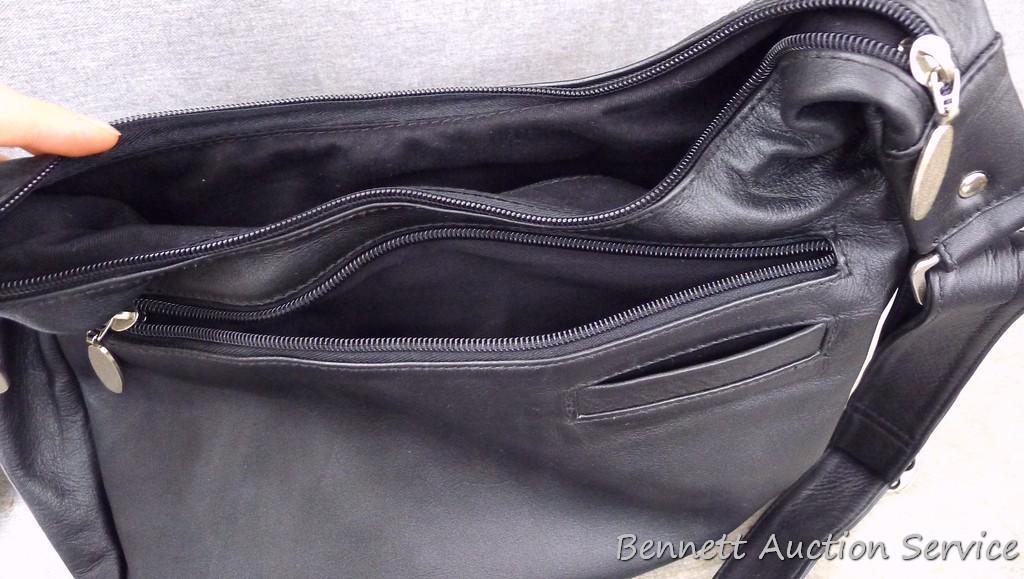 Rama Leathers genuine cowhide leather concealment purse is like new. Bag measures about 14"x 11",