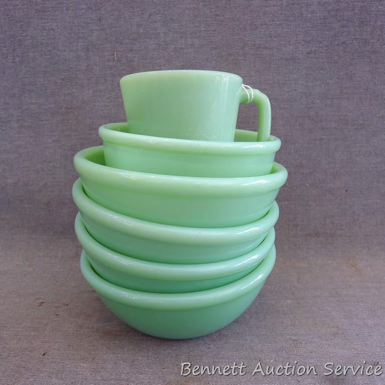 Jadeite Fire-King ware. Four 5-1/2" bowls, one 4-3/4" bowl, one coffee mug.