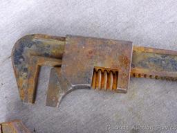 Antique wrenches includes 13" pipe wrench; 11" auto wrench; D239 specialty wrench and one other.