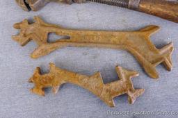 Antique wrenches includes 13" pipe wrench; 11" auto wrench; D239 specialty wrench and one other.