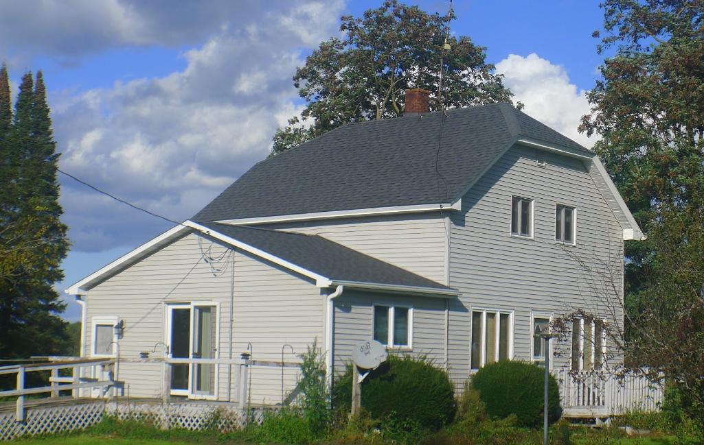 Northern WI country home with huge outbuilding.  Beautifully surrounded by fields and forest.