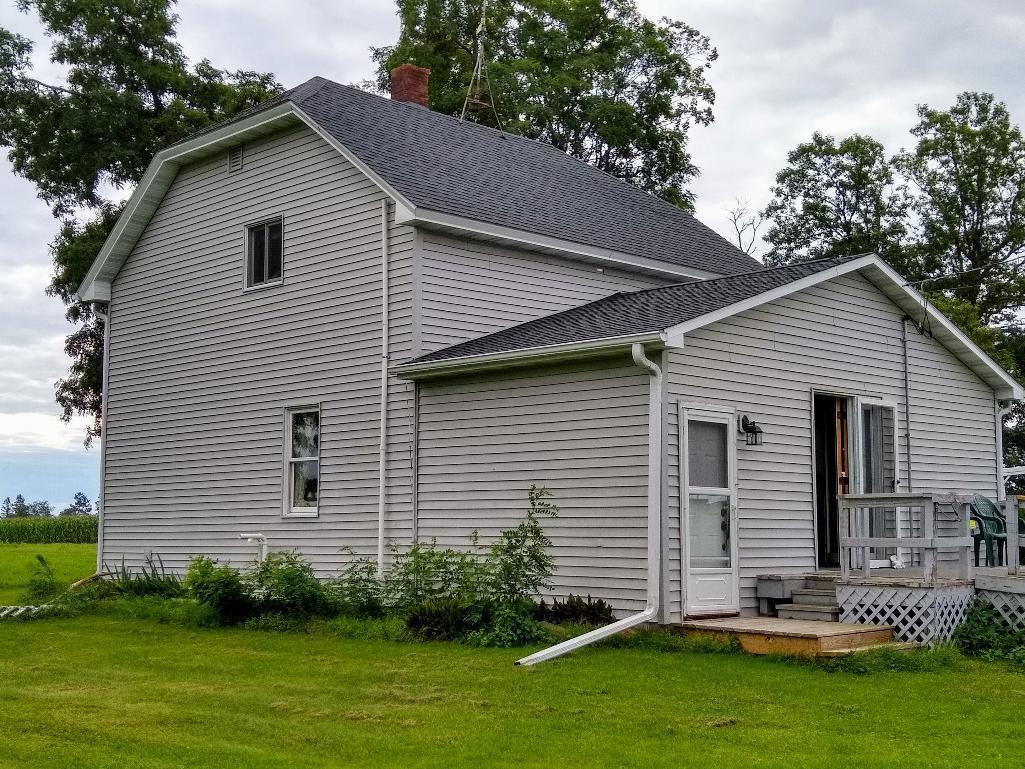 Northern WI country home with huge outbuilding.  Beautifully surrounded by fields and forest.