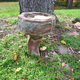 Two piece stone bird bath stands approx. 18" tall.