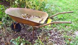 Antique wheel barrow will look great in your yard. Over 4' long.