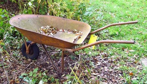 Antique wheel barrow will look great in your yard. Over 4' long.