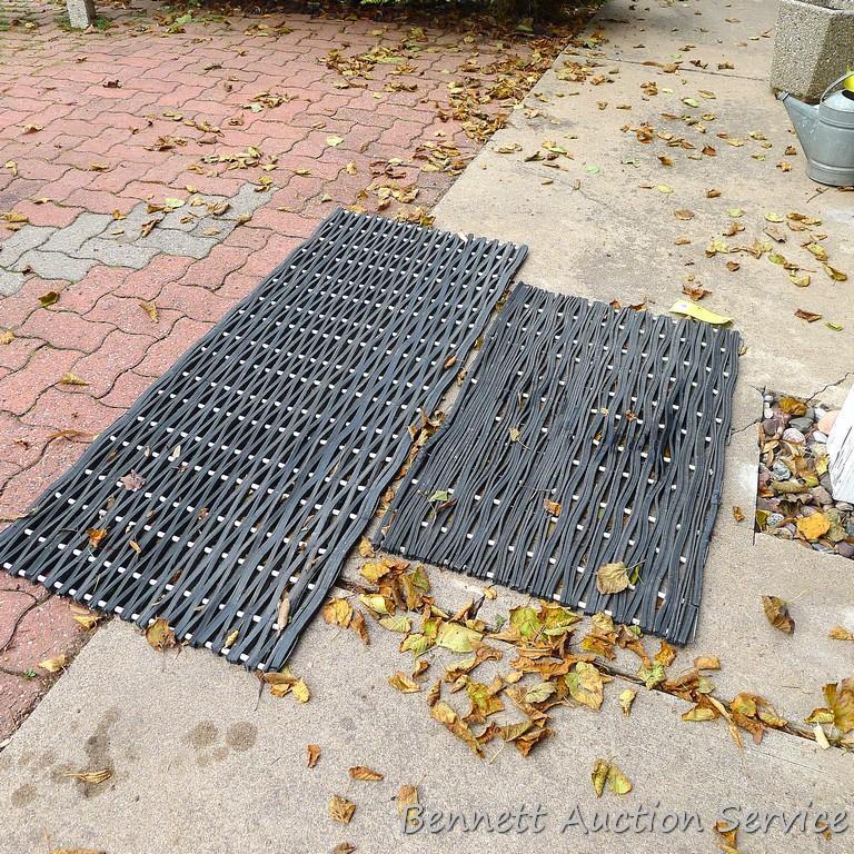Two nice heavy duty rubber entry mats, larger measures approx. 5' x 2'.