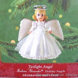 Three Hallmark Keepsake ornaments includes Barbie. Taller boxes are about 6". Come with packaging.