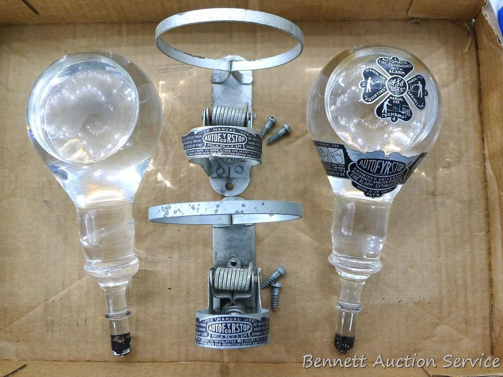 Two vintage AutoFRYStop glass fire extinguishers come with mounting brackets. Glass part measures