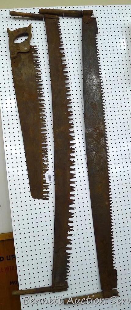 2 antique two man crosscut saws, longest is about 70" long and 5-1/2" wide; one man saw is 42" long.