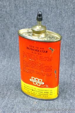 Vintage Winchester 3 oz gun oil can is 4-1/2" x 2-1/4" x 1". Graphics are nice, cast metal spout,