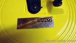 Bayco Model 800 125 volt 10 amp hanging cord reel. Ceiling or wall mountable with auto-retract.