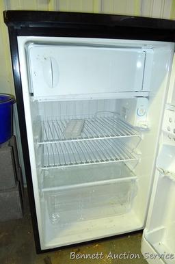 Kenmore dorm sized refrigerator/freezer is 20" x 21" x 34" tall. Runs and cools. Needs cleaning.