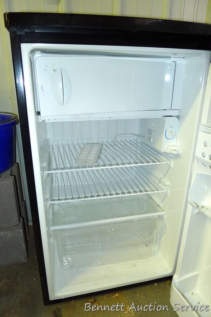 Kenmore dorm sized refrigerator/freezer is 20" x 21" x 34" tall. Runs and cools. Needs cleaning.