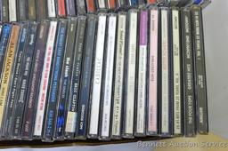 Box of CDs incl Wayne Jennings, Conway Twitty, Toby Keith, Vince Gill, Clint Black, Randy Travis,