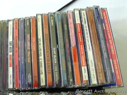 Box of CDs incl Wayne Jennings, Conway Twitty, Toby Keith, Vince Gill, Clint Black, Randy Travis,