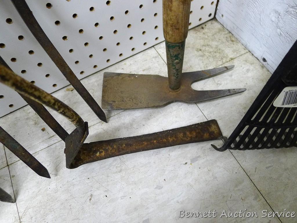 Pitch fork, grass trimmer, hand rake, hand hoe and spade shovel.