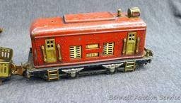Fancy Lionel O gauge engine has cracked wheels and is ready for restoration. Another similar car,