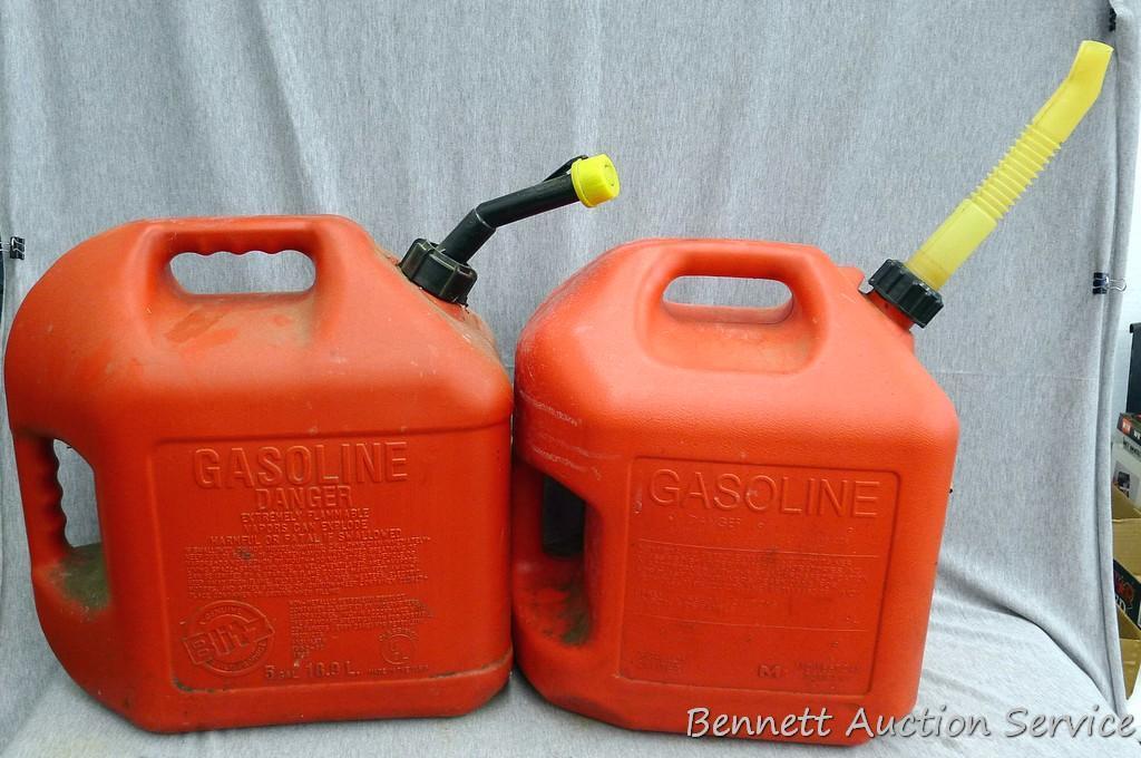 Two 5 gallon gas totes with spouts.