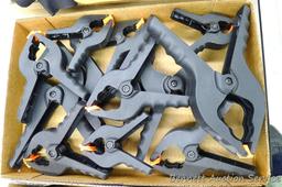 Assortment of hand clamps, largest is 9" x 4".