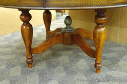 Pretty dining table is in good condition and quite sturdy. Table measures 30" high x 60" diameter.