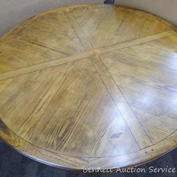 Pretty dining table is in good condition and quite sturdy. Table measures 30" high x 60" diameter.