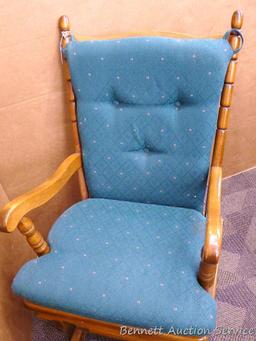 Wooden glider rocker moves smoothly and is about 23" x 23" x 38" tall. Some scuffs noted,